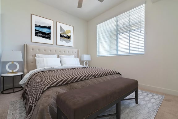 Bedroom with window view at Portola Senior Apartments, Carlsbad, California